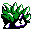 a digital pixel drawing of a dark, hollow-eyed grassy lump.